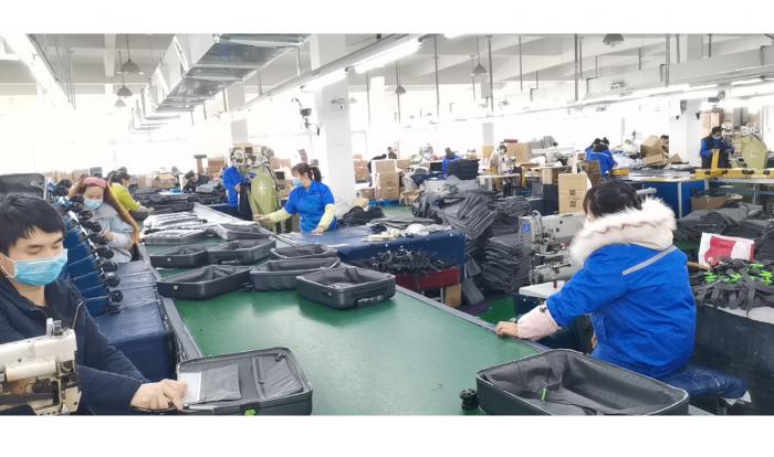 Better luggage for better traveler. Many workers are coming back to factory after long Coronavirus holiday .